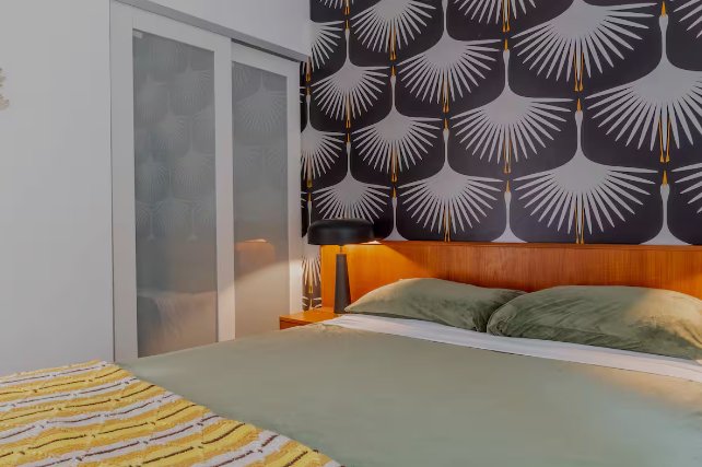 Villa bedroom with sunburst wallpaper